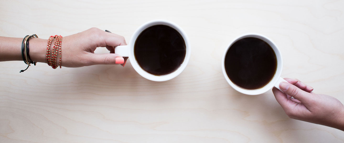 Image of two hands holding coffee cups for FarOffice Limited